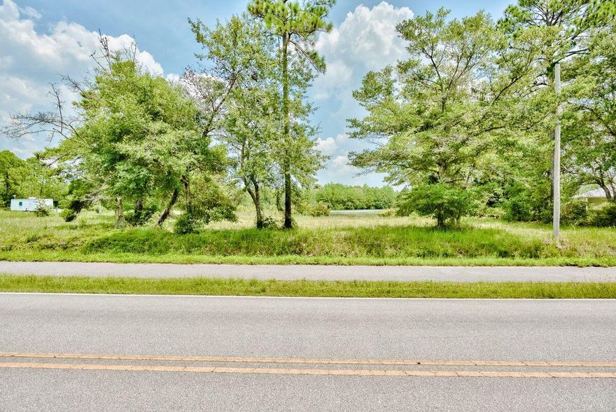 Build your dream home on this half acre lot across the street from the Choctawatchee Bay and backing up to a lake. Located just 15 minutes to the beaches of South Walton and close to Hammock Bay. No build out time and no HOA.