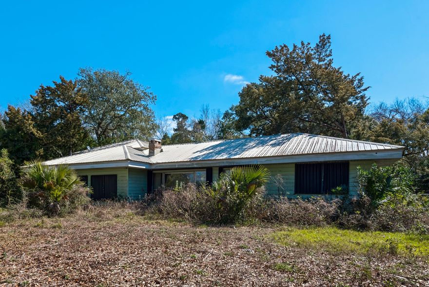 Once in a lifetime piece of paradise in the heart of Destin. A beautiful property across from Crab Island with a beautiful view of the emerald blue water. This would be a gorgeous setting to build your dream home and be close to the harbor and of course the white sand beaches. Three homes on the property have hosted a variety of family and friends and recently rental income. So much potential for this unique piece of land on a quiet area tucked away with lots of trees and winding driveway. Call listing agent for your showing.