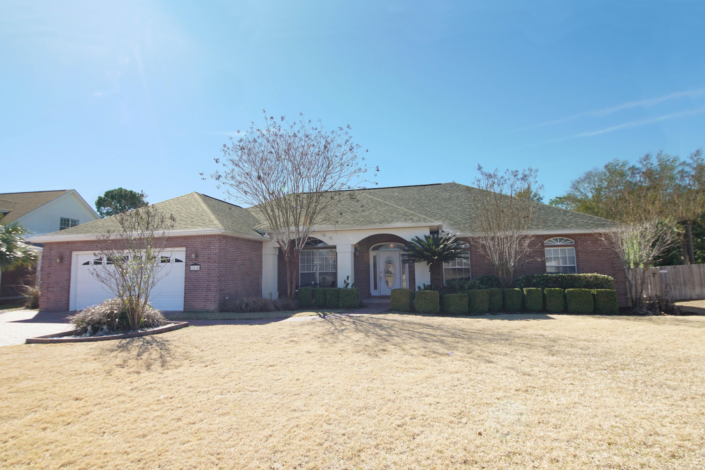Move in ready! Four bedroom with 16x32 ft saltwater gunite pool, oversized yard. Pull into the paver driveway to this lovely brick home with stucco trim. Step into the foyer from the tiled and covered porch and leaded glass door to an open space living area with double treyed ceilings, double crown molding and gas fireplace. An additional flex space (playroom, game room, home theater, etc) is contiguous to the main living area, offering lots of possibilities for use of space and furniture arrangement. There's room for a pool or ping pong table or freestanding video games. All flooring is 17x17 inch tile. This room has double French doors and telescopic sliders to the back deck/pool area (trek deck for easy maintenance), plus a relaxing view of the outside space.