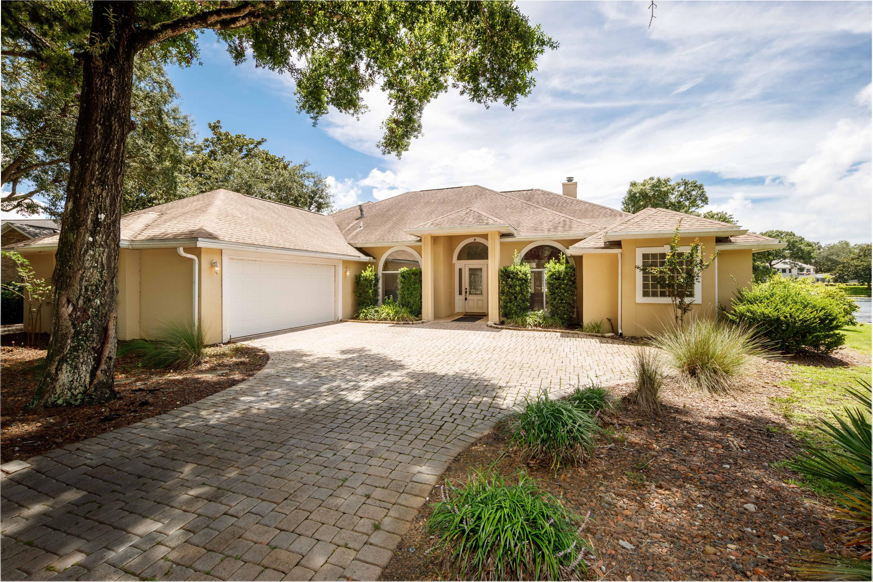 Beautiful lakefront pool home located on the quiet shady loop of Oaklake Lane. Step inside the foyer for a direct view through the living room, screened pool and expansive back yard and lake. Light and bright with oversized windows & french doors. Lots of open living space PLUS bonus bedroom and bath! Almost every room in the house enjoys lake views. The open kitchen has a wall of windows over an inviting window seat and its own french door pool access. Primary bedroom/bath oasis enjoys a huge walk-in shower, dble vanity AND its own private pool access. Don't miss the very private 2nd floor bed/bath perched above the pool and lake. Paver drive, high ceilings, bamboo floors, so many features. Add some TLC and your own color palette to make this your very own showplace retreat!