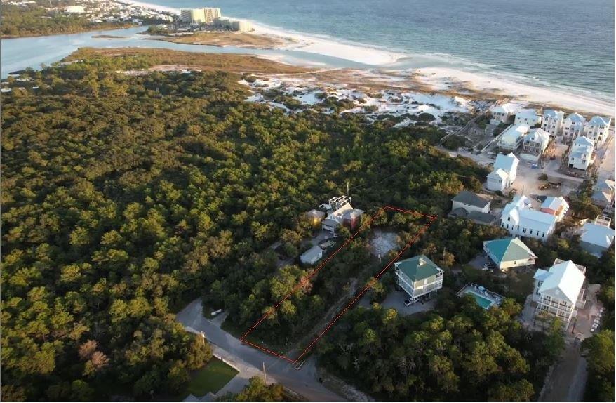 Private, heavily wooded 0.62 acre lot, located on a ridge with an elevation of 25 feet, the highest point in Inlet Beach.  One lot from Camp Helen, the views from a second and third floor will be incredible.  Standing on the second level you can see over the treetops for beautiful views of the Gulf and of Camp Helen.  Recently completed boundary and topographic survey can be seen in photos.  Just a five minute walk to the uncrowded beaches of Camp Helen.  This amazing location is5 minutes from dining and shopping at 30 Avenue and Rosemary Beach.  This lot is a quick 25 minute drive to the Northwest Florida Beaches International Airport.  This is a rare investment and building opportunity.