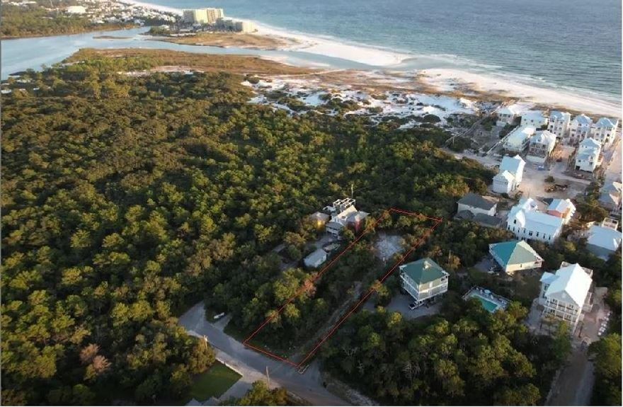 Private, heavily wooded 0.62 acre lot, located on a ridge with an elevation of 25 feet, the highest point in Inlet Beach.  One lot from Camp Helen, the views from a second and third floor will be incredible.  Standing on the second level you can see over the treetops for beautiful views of the Gulf and of Camp Helen.  Recently completed boundary and topographic survey can be seen in photos.  Just a five minute walk to the uncrowded beaches of Camp Helen.  This amazing location is5 minutes from dining and shopping at 30 Avenue and Rosemary Beach.  This lot is a quick 25 minute drive to the Northwest Florida Beaches International Airport.  This is a rare investment and building opportunity.
