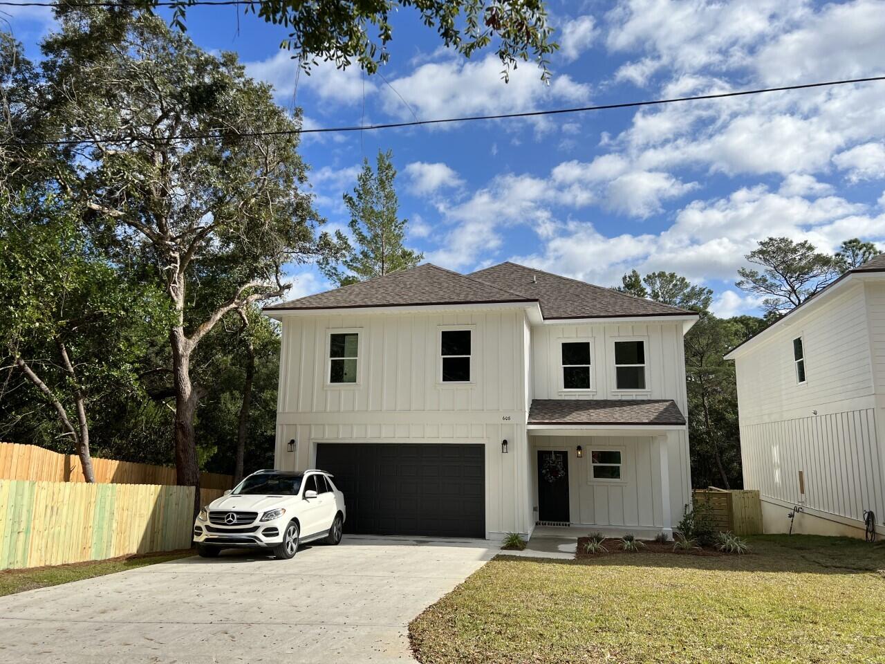 This Beautiful 4 bedroom, 2 1/2 bath home is located in the heart of Niceville, yet beautifully secluded on a dead-end street. The bedrooms are LARGE and have walk -in closets. If you like entertaining, you'll love this OPEN FLOOR PLAN, featuring 9 ft. ceilings throughout, an oversized garage 27.6x22.8, upgraded spray foam insulation in the roof. The kitchen is divine with white custom cabinets, soft close drawers, upgraded sink, GAS stove, walk in pantry and quartz countertops throughout. Enjoy the upgraded lighting, and floor plug in the family room for lamps or phone cords.