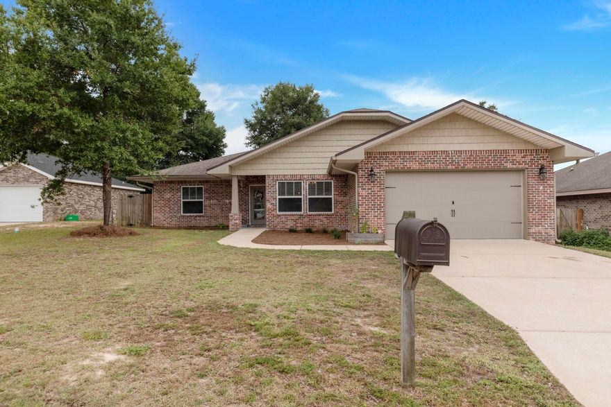 $5,000 towards Buyer's Closing Costs! Beautiful 4 bedroom 2 bathroom all brick home built in 2017! Custom floor plan by multiple award winning builder and 2017 Parade of Homes winner! This home offers 10 ft. ceilings w/ impressive crown molding, 12x24 offset tile flooring, and 5 1/4'' baseboard throughout the main living areas. On the exterior of the home, this Craftsman style home has a covered porch w/ columns  and 8 ft leaded glass door. The privacy fenced backyard has shade trees and a generous covered open porch perfect for entertaining. The exterior also has an irrigation system, rain gutters and  a two car front entry garage and driveway. As you enter the home you are greeted by a long foyer escorting you to the living room. The large living room boasts tile flooring, crown molding ceiling fan, and recessed lighting. The living rooms open concept blends into the kitchen separated by the long breakfast bar counter top and bar stools. The kitchen is a chef's delight kitchen which boasts maple cabinetry, granite countertops, a huge pantry, and stainless appliances (including an oversized commercial grade refrigerator/freezer, dishwasher, microwave, smooth top range). Between the kitchen and the dining room you will find a wet bar and wine refrigerator. The spacious formal dining is adorned with crown molding and connects to both the kitchen and the main foyer. The master bedroom is privately located on the right side of the home and has crown molding, ceiling fan, and two windows for plenty of natural light. The master bathroom and his/her closet are equally as large as the master bedroom. The master bathroom had a jacuzzi tub, separate walk-in tile shower, double vanity, water closet, his and her closets and linen closet. On the other side of the home, you will find 3 additional large bedrooms with spacious closets. Two of the bedrooms share a Jack and Jill bathroom that can also be shared with guests. The indoor laundry room also offers plenty of space and connects to the 22' deep x 20' wide garage, complete with pull down stairs and auto opener. Don't miss out on your opportunity to see this beautiful custom touches you just don't see every day. Schedule your showing today!