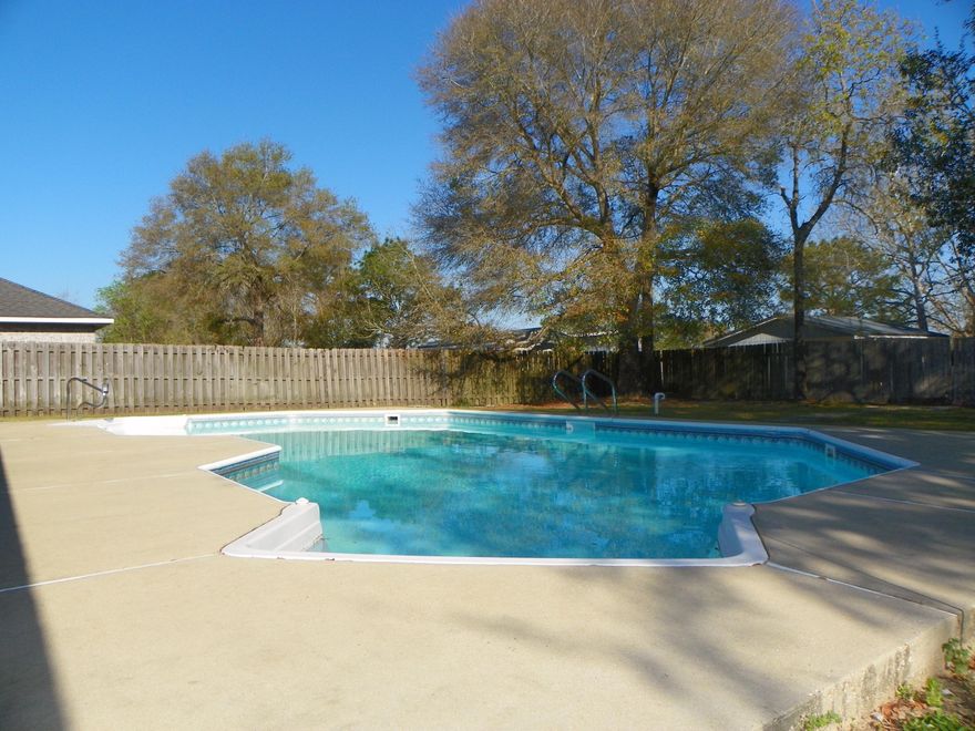 South of I-10, 4 bed/2bath, brick home, LEVEL LOT with IN-GROUND POOL! Brand NEW ROOF coming shortly! Seller offering 1 year Home Warranty! (Old Republic $425). Convenient location south of town, this move-in ready home has a lot to offer! Open living area with split bedroom plan. Dining Area is located off of Living Room, which has view of In-ground pool! Security System installed. Eat-In Kitchen offers lots of counter space, cabinets, island (moveable), and pantry. Separate laundry room is located off of Master Bedroom! Master Bathroom has double vanity, soaking tub, separate shower and walk-in closet. Get ready for the warm weather with this amazing in-ground sports pool! Large patio for all of your outdoor furniture to entertain or just to relax!