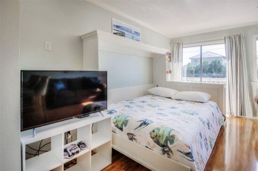 This cute studio condo on Holiday Isle has recently been renovated with new paint, floors and appliances. The condo has a queen size murphy bed which makes this studio surprisingly spacious.   The living area also has a love seat and full sleeper sofa. There is a new smart TV (roku) and nintendo in the livingl The kitchen has all new stainless steel appliances and a beautiful tiled backsplash.   It is fully equipped to handle all your cooking needs for times when you want to stay in.    The bathroom has a tub/shower combo with new tile. Enjoy coffee each morning or catch stunning sunsets on the balcony right off the living room.   This condo is located by so many attractions.   The public beach access is a short 5 minute walk from the condos.