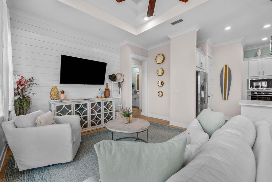 Experience the pinnacle of coastal living in this luxurious, family-friendly townhouse in the tranquil, quieter section of the Prominence community. This beautifully redesigned tri-plex unit blends modern elegance with laid-back beach vibes, offering a perfect retreat just steps from the resort-style amenities and vibrant atmosphere of The Big Chill. Situated less than a mile from the newly renovated Deer Lake beach access, this home ensures convenience and relaxation in one of 30A's most desirable neighborhoods. Inside, the townhouse boasts 10-ft. ceilings, a gourmet kitchen with quartz countertops, farm sinks and Electrolux appliances, including a built-in microwave, stove and dishwasher. The open-concept living space features shiplap accent walls, adding a charming coastal touch to both the living area and master suite. Upgraded hardwood floors and soft-close cabinetry throughout elevate the interior design, while the master bath indulges with a luxurious rain shower head. Perfect for families or investors, this two-bedroom townhouse offers a serene escape with excellent rental potential. The property enjoys a quiet location in the back of the neighborhood, providing a peaceful retreat from the activity of the neighborhood. Prominence itself offers two resort-style pools, a fitness center and easy access to local dining, shopping and entertainment. Whether you're seeking a stylish second home or an investment property priced less $850,000 with strong rental history, this townhouse in Prominence delivers an exceptional blend of luxury, comfort and coastal charm.
