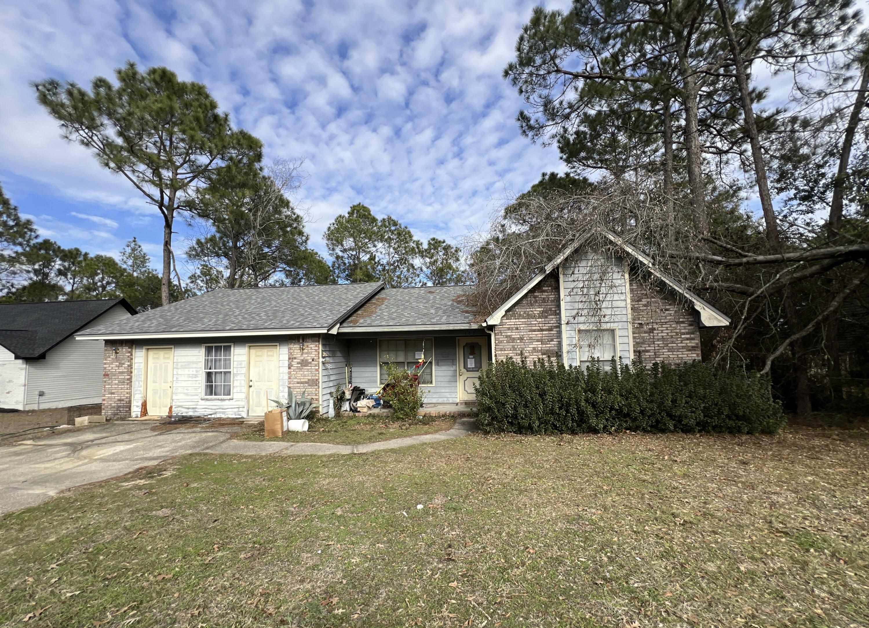 Enjoy all to benefits of your labor in the conveniently located REO property. Originally built in 1992 with a 2 car garage, this 3 bedroom 2 bath home has wood siding, a dimensional shingled roof and deck off the back of the property. The garage has been converted to living/storage and includes the laundry area. The Kitchen is large and opens to a dining area then living room with brick wood burning fireplace and semi vaulted ceilings. This property is just a few miles from interstate access, military bases and more. A must see to appreciate.