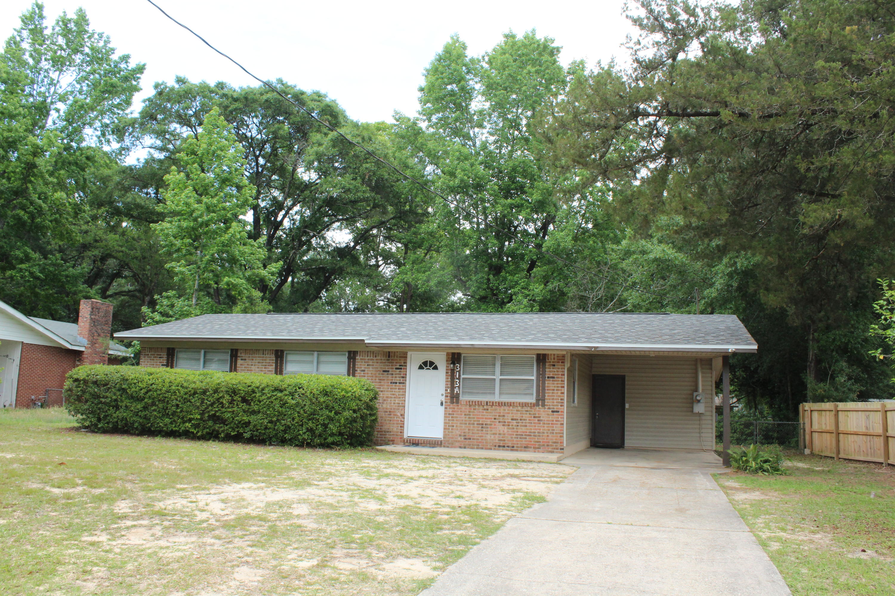 Beautiful, completely renovated brick home located close to Historic Downtown Crestview featuring 1,159 square feet with 3 bedrooms, 1.5 baths, a family room, a laundry room, and a sunroom! New 2020 dimensional shingle roof (2021), new HVAC (2019), newer Hot water heater, new interior painting, new light fixtures and many more updates! The kitchen features refurbished cabinetry, granite countertops, a new subway tiled backsplash, a built in microwave, stainless and black stove and dishwasher and a side by side refrigerator with icemaker! There is an eat in dining area near the kitchen with a new chandelier. In addition, there is a nice size laundry room! There kitchen and dining area opens to the living room and sunroom!