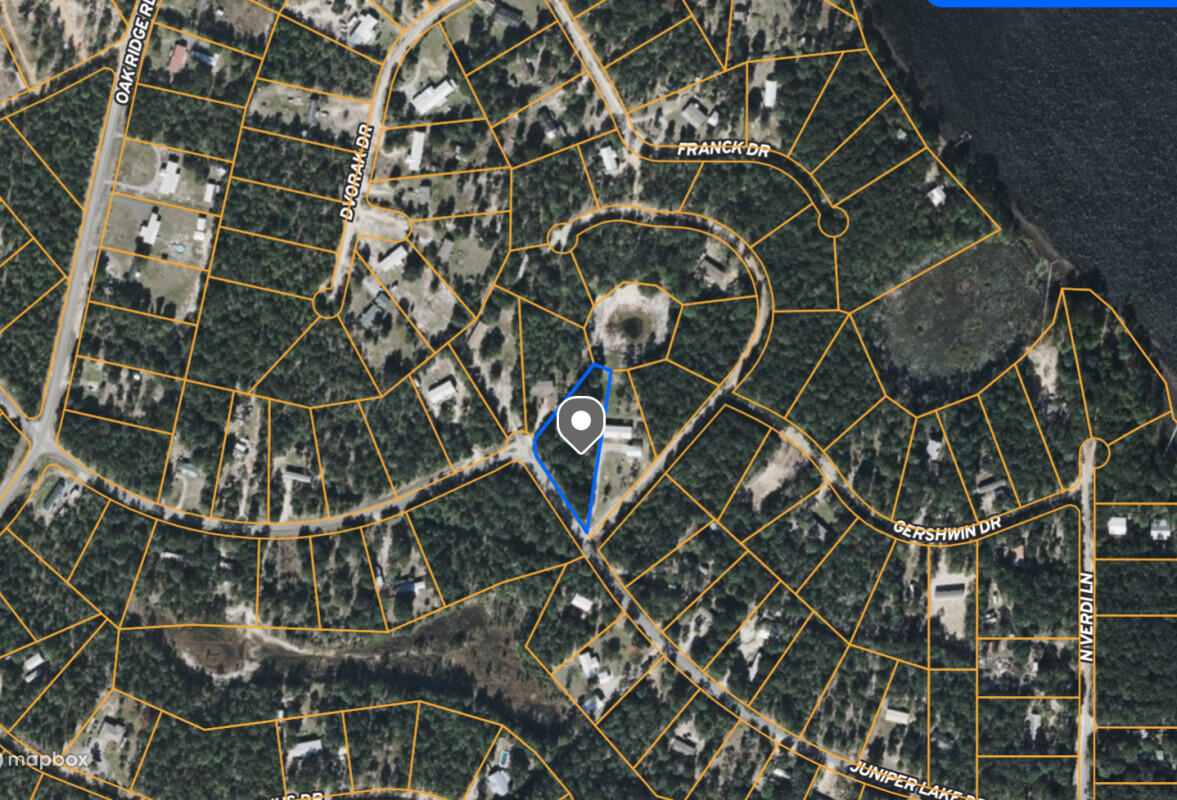 Large 1.5 Acres At Juniper Lake! Peace and quiet of rural living just feet away from Juniper Lake! Close to all amenities and beaches. Convenience of nearby Pensacola, Tallahassee, Destin Beaches and Panama City Beach as well as shopping, dining, and entertainment. Just 53 minutes from beautiful James Lee Beach in Destin! PAVED Road and No HOA.