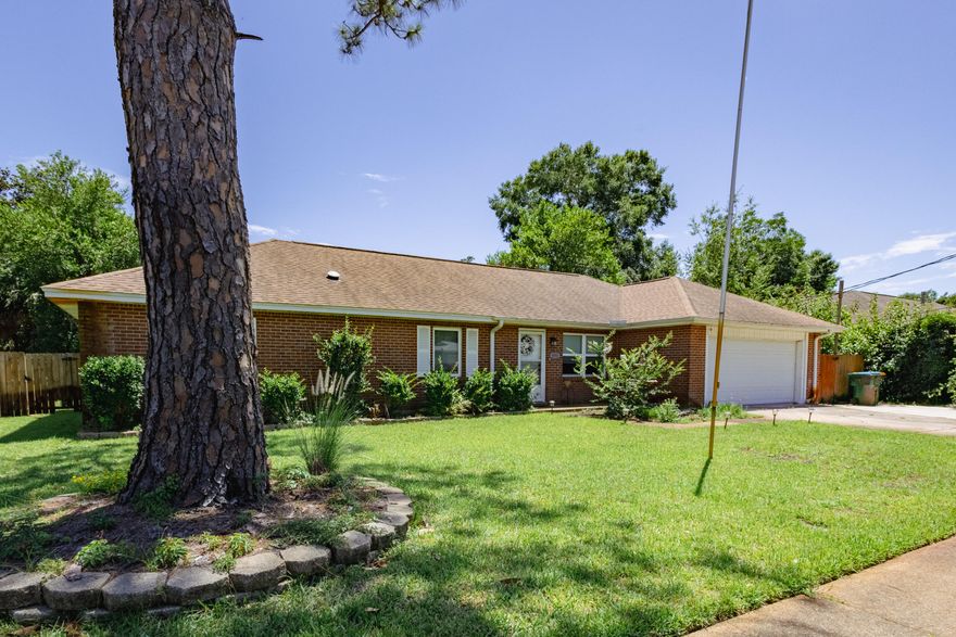 Updated 4 bedroom home with split bedroom plan! Living room features a vaulted ceiling and is open to dining and kitchen offering a spacious feel. Granite counters, stainless/black appliances in kitchen and LVP flooring in main areas. Shared bath for two of the bedrooms, separate bath for third bedroom also accessible from hall and a double vanity cultured marble sink and shower stall in the Master suite addition (2015), along with a walk in closet. Spacious fenced backyard with covered patio and storage shed. Extra parking pad at driveway. Roomy garage with pull down stairs/storage. Convenient location close to shopping, dining, Eglin and minutes from the Sound and Beach accesses!