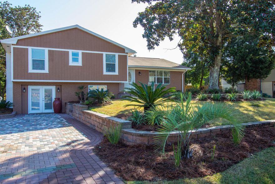 Huge Price reduction. Seller says bring ALL offers. Beautifully Remodeled 4bd/3bth home on a large half an acre lot just 2 blocks from Destin Elementary School. This is a rare find, hardwood and travertine flooring throughout the entire home, new kitchen cabinets and appliances, new roof(2013), new A/C(2013), all new impact windows and doors. The concrete in-ground pool has just been replastered and brand new pool pump and equipment, surrounding the pool is a very large new brick paved patio. Driveway is large enough to park a R.V. down the side and still have plenty of room for additional cars. This is a great home to raise a family in.