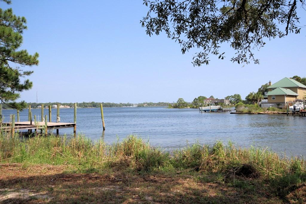 NOW is your chance to live on Sarah Anne Bayou and enjoy 226' of protected DEEP water!! This 1996 built home sits on a unique .61 acre lot with 226' of waterfrontage with a deep water dock that has accommodated a 31' sailboat in the past. The house sits far enough back on the lot that it is OUT of the flood zone so no flood insurance is required. The back of this naturally landscaped lot is shaded by lots of hardwood trees that make you feel like you are under a wooded canopy. There are wonderful views of both Sarah Anne Bayou and Rocky Bayou that can be enjoyed from the 400sf back deck or charming gazebo in the back yard. The home was custom built for the sellers who have meticulously maintained it throughout the years. There are hardwood, tile and marble floors throughout CLICK MOR