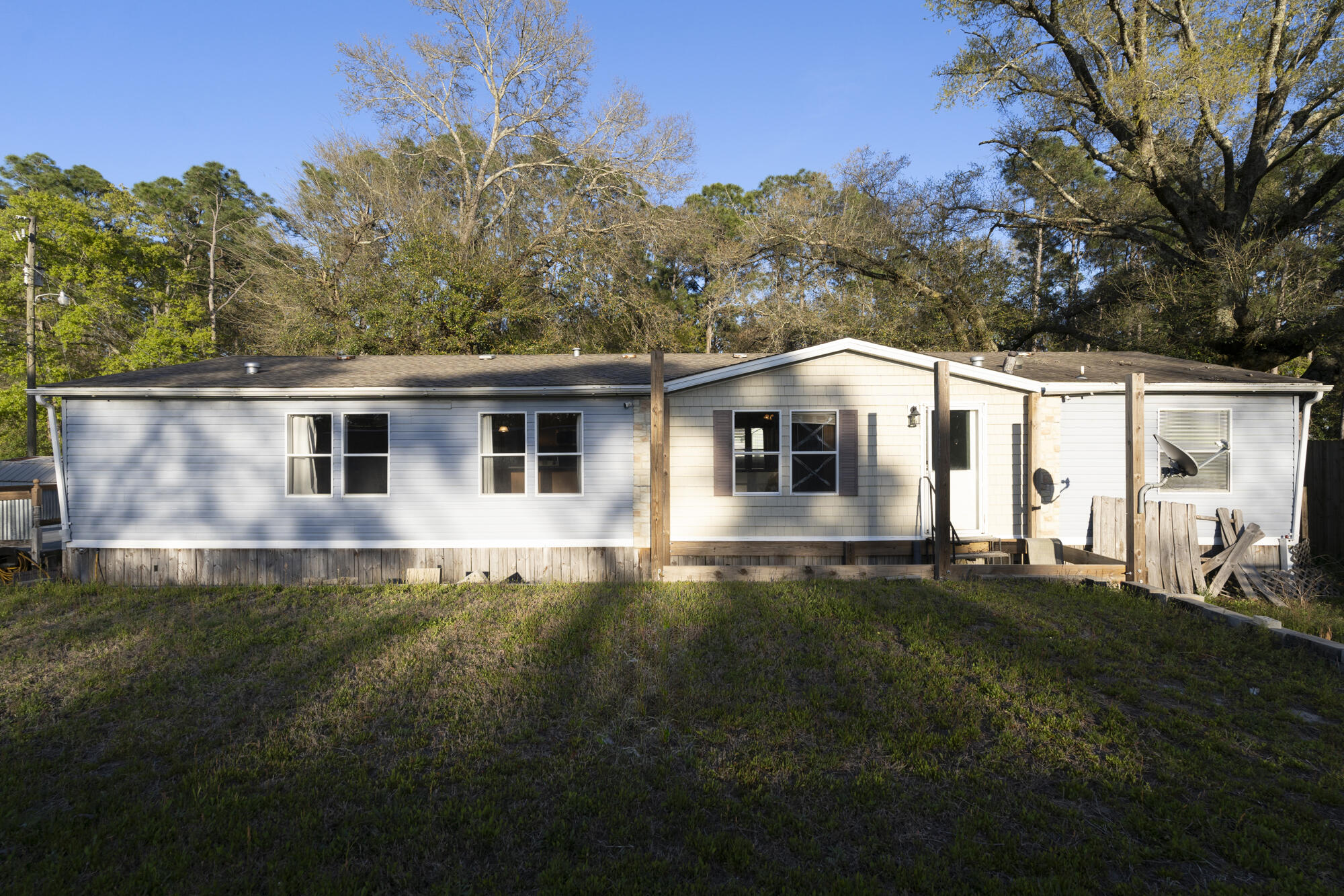 Welcome to 8411 Estrella Street, located in the vibrant Panama City Beach community. This 2008 double-wide home offers 3 bedrooms and 2 bathrooms, providing ample space for comfortable living. Situated on the east side of the beach, this property boasts proximity to multiple public beach accesses, allowing for easy enjoyment of the stunning Gulf Coast.Convenience is key with shopping, entertainment, and recreational options just a stone's throw away. Explore the nearby Rick Seltzer Park for picnics and beach days, or venture to St. Andrews State Park for adventure and nature trails.While this home requires some TLC, with a lot size of 110x75, it presents a perfect investment opportunity for those looking to put their personal touch on a property. Don't miss out on the chance to