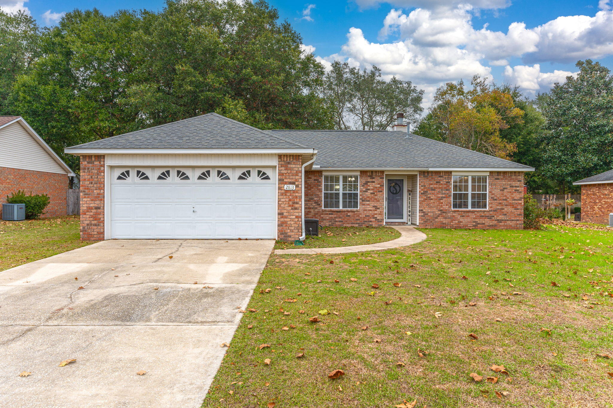 Upgrades galore! This immaculate 3/2 is not one to miss. From the moment you walk in, you will be in awe at the updates in this home. Heading into the livingroom and you will immediately notice the gorgeous porcelain wood look tile, wood burning fireplace,and views of the fully fenced backyard. There is a dining area off of the livingroom as well as a seperate laundry room. The kitchen boasts a white tile backsplash, quartz countertops, breakfast bar seating, stainless steel appliances, a breakfast nook, and a gas stove. The master suite is generously sized offers TWO walk-in closets, a double vanity, quartz countertops, and a soaker tub. The two remaining bedrooms are spacious as well. Head out back and relax on your open patio in your privacy fenced backyard.