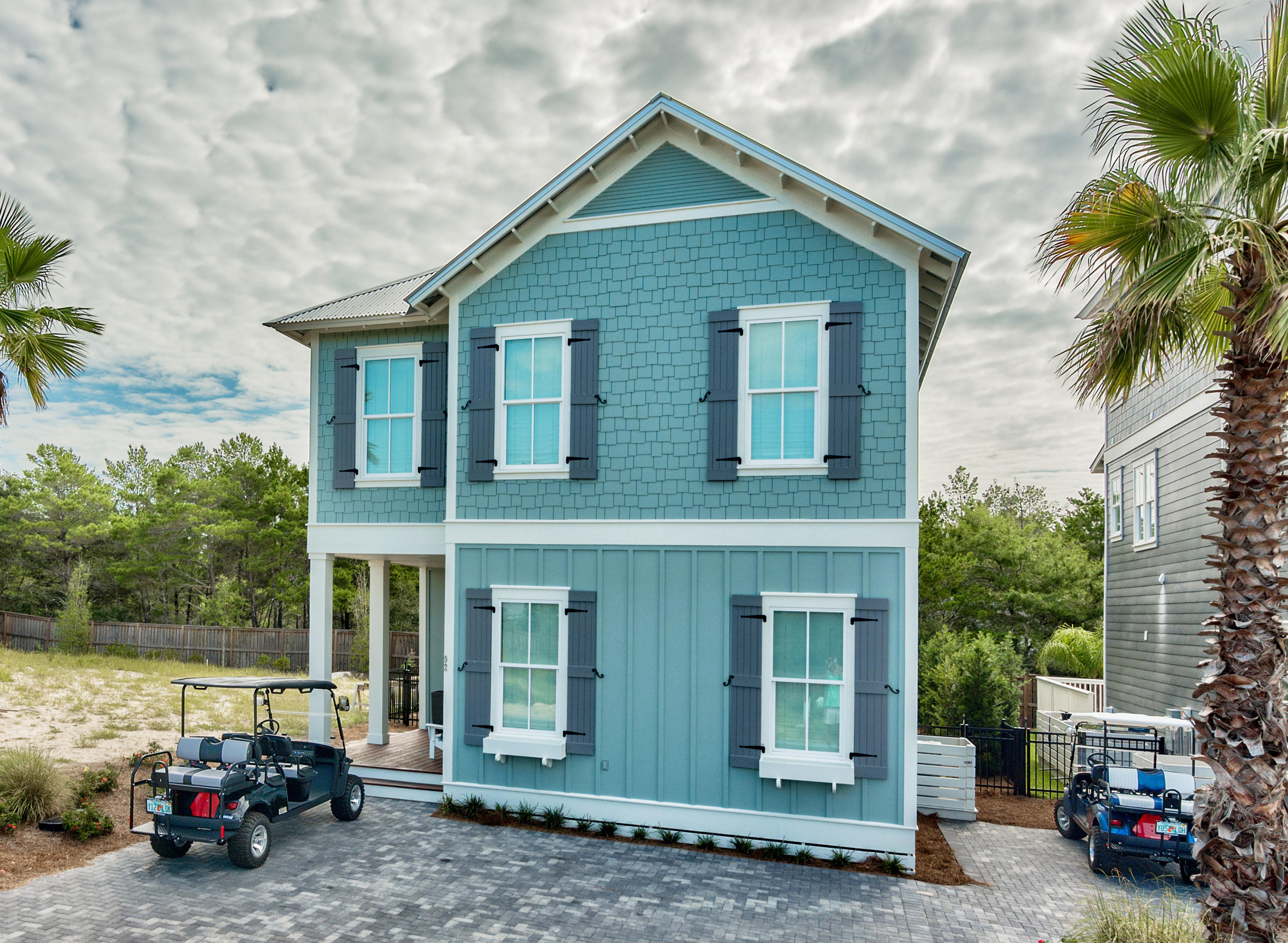 Nestled in the heart of Blue Mountain Beach, Dune Side is a quaint neighborhood consisting of just 22 homes. The Palm is our most popular plan - includes a screened summer porch with grill and out door kitchen! Tons of storage space beneath the home. Dune Side at Blue Mountain Beach features gracious lots allowing for private pools, large owner's park area, a shuttle service to the beach, lush landscaping and convenient accessibility to all that Blue Mountain Beach has to offer.The homes in Dune Side at Blue Mountain Beach are by Chi-Mar Construction, a full-service builder specializing in single-family homes in the Destin and 30A area.The Palm Floor Plan on LOT 17 has 4 Bedrooms + bunk area and 3.5 Baths.2209 sq. ft. with covered porch and balcony.LOCATION, LOCATION, L