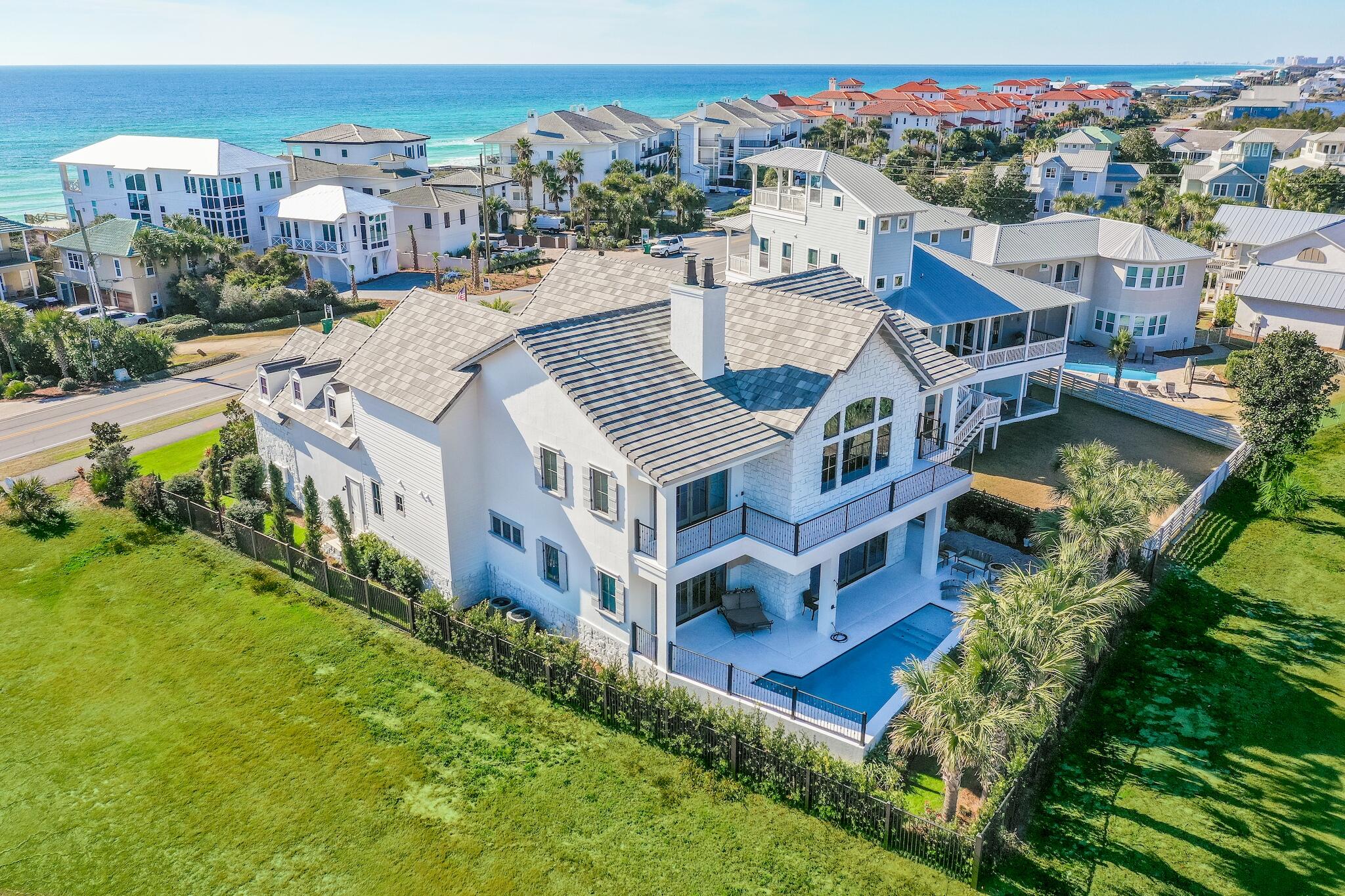 This one of a kind custom home is located in the premier spot along 30A taking full advantage of the views of both the Santa Rosa Beach & Golf club and the Gulf of Mexico all while overlooking your own private pool. Built by local award winning builders Dixon Kazek here on the Emerald Coast with luxury, quality and pride of ownership in every detail. Just a few of the details include quartz counter tops, custom cabinetry throughout - sliding custom barn doors, a curved majestic staircase, wood beams, a state of the art home theater with a private bar in addition to the custom bar off the main living area make this home perfect for entertaining or rental.  Beach access is just steps away - no HOA to contend with. walking distance to Gulf Place