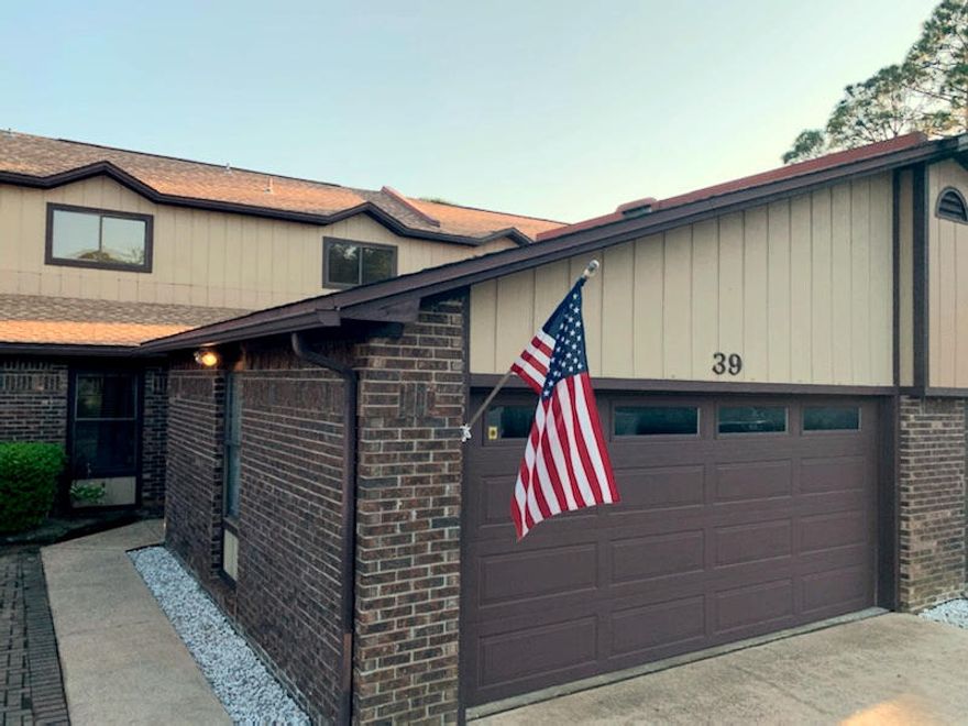 This cute and clean 3 bedroom, 2.5 bath townhome offers a first-floor master bedroom with walk-in closet and recently updated master bath, an open concept living space, and a back deck. Living room has a working fireplace and two sets of sliding glass doors that open to the deck. Second floor loft space perfect for a home office. First floor half bath has been remodeled. New roof in 2018. Two car garage with storage above. Property is in Flood Zone X; flood insurance NOT required. No lawn maintenance.Located in the established Hidden Cove community, an ideal location for those wanting water access on the beautiful Toms Bayou. The Hidden Cove neighborhood has a pool, fitness facility, and a community dock that offers boat slip rentals for its residents.