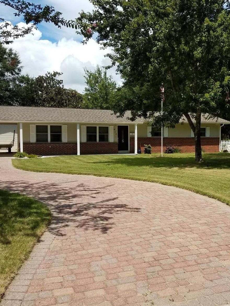 Extremely well maintained, renovated block home on large corner lot in cul-de-sac location. Manicured lawn, fenced back yard, storage building and storm shelter. All ceramic tile floors. 2004 renovation included all new windows, full kitchen replacement, roof replacement, wiring. Tankless gas water heater. 2004 amazing 3 car garage with full bath, attic and work space. 2008 sprinkler system. 2016 AC.