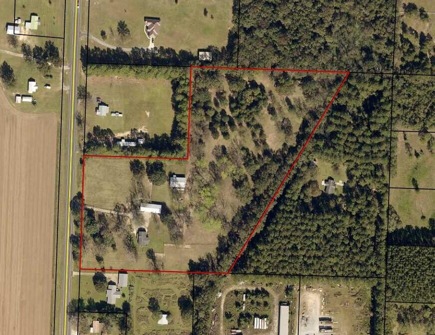 3 bed/2 bath 1586sf manufactured home on 13 acres with 2 pole barns.  Conveniently located on Hwy 189 N. in Baker, just a short drive to Crestview.  Fully fenced with large trees throughout the property.