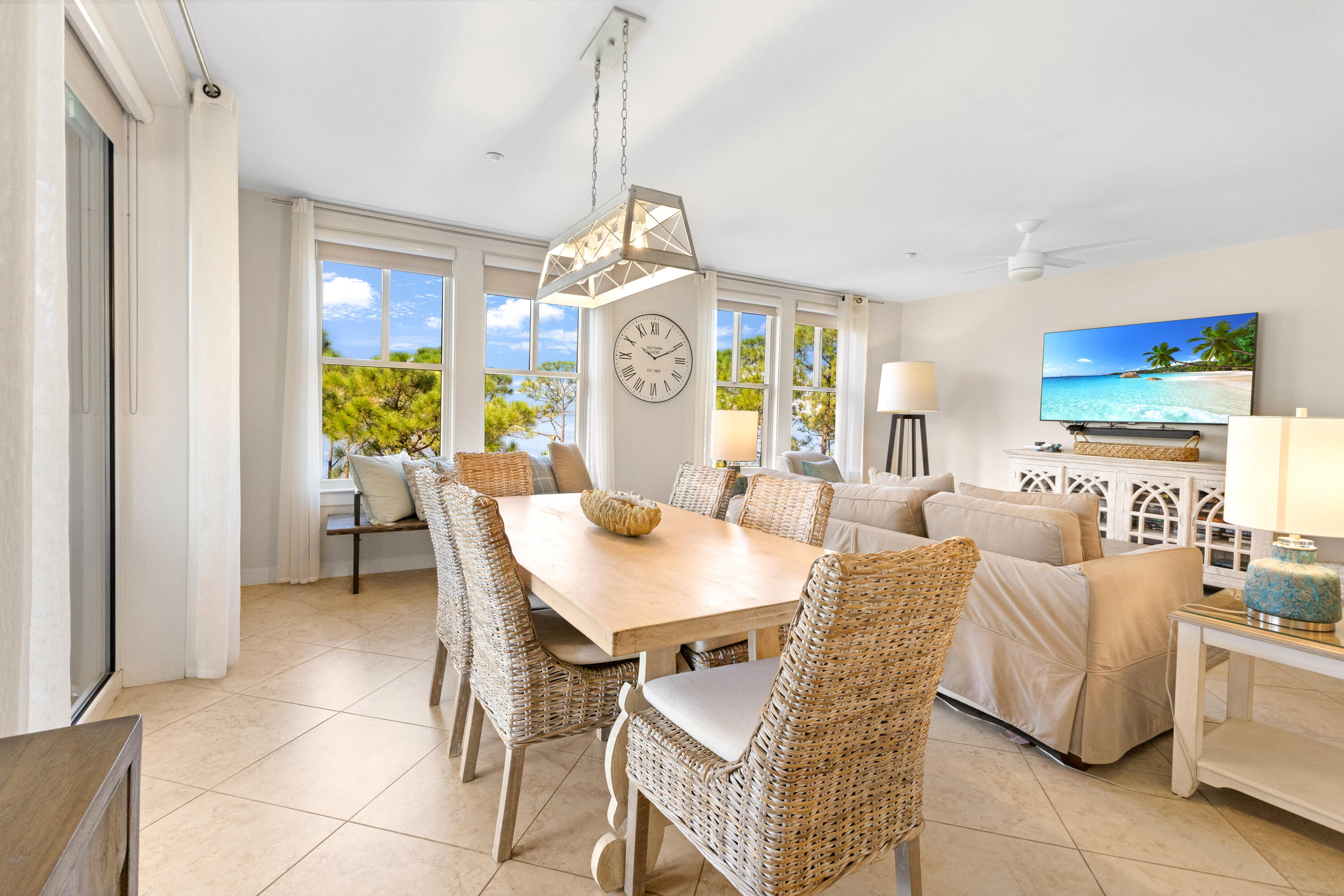 Located on the 4th floor of Bahia, this bayfront end unit offers sweeping water views from nearly every room. Featuring 3 bedrooms & a spacious split open-concept design, the floor plan is ideal for hosting family or guests. The entry opens to a kitchen with a breakfast bar that flows seamlessly into the dining and living areas, where large windows bring in abundant natural light and frame the stunning bay vistas. Glass doors extend the living space onto a rounded balcony, creating the perfect setting for entertaining or simply enjoying the view. The 3rd bedroom is designed as a private studio with its own kitchenette, living space, full bath, and separate entrance, providing excellent flexibility for rental opportunities if desired. In addition, Hotel Effie is nearby with a rooftop pool and bar and fine dining at Ovide. Owners also have access to the private Solstice Club, an amenity for owners and their guests, featuring grills, screened porch with gas fireplace, indoor bar, flat screen TV and comfortable seating inside and out.
As an introduction to the Sandestin lifestyle, we invite our new owners to explore amenities that make Sandestin special. The listing brokerage and seller(s) are presenting the buyer(s) of this property with (2) 90-minute rounds of Tennis court time, a golf foursome at one of our three championship courses, and a round of golf for up to four (4) players at the unrivaled Burnt Pine Golf Club.
Sandestin Golf and Beach Resort features more than seven miles of beaches and pristine bay front, four championship golf courses, 15 world-class tennis courts, a 226-slip marina, a fitness center, spa and celebrity chef dining. Shop, dine and play at the charming pedestrian village, The Village of Baytowne Wharf and more. Inside the gates of the resort, residents enjoy a balanced lifestyle of high-class living, spanning the 2,400 acres from the beach to the bay. Everything within the gates of the resort is accessible by golf cart or bicycle. The entire resort is interconnected by miles of pedestrian, bike and golf cart paths that weave through groves of live oaks, meandering past natural lagoons, fountains, man-made lakes, and meticulously landscaped fairways.