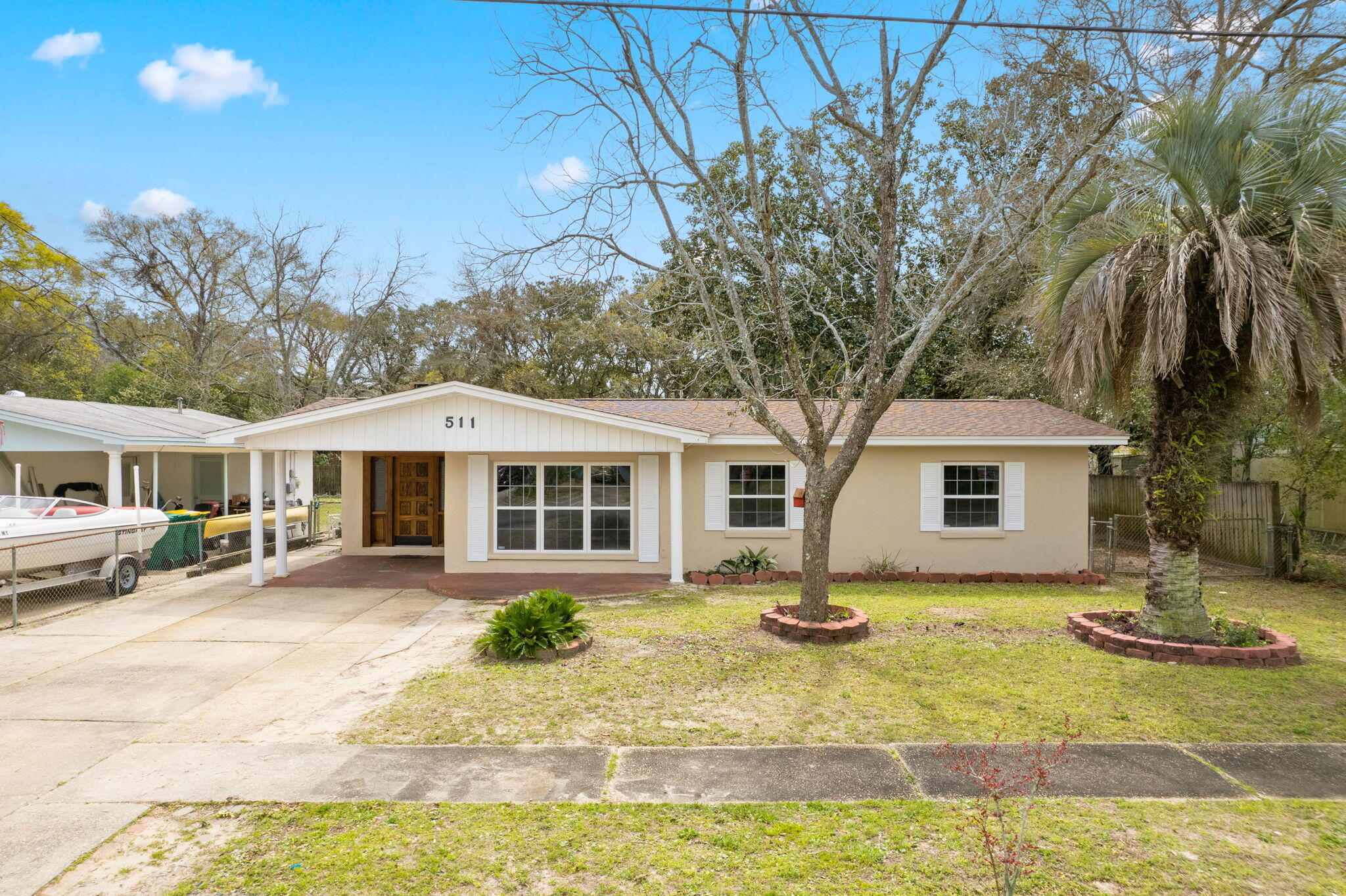 Discover the perfect blend of comfort, style, and functionality in this distinctive family home! This home is ideally located to travel to Eglin, Hurlburt Field and Destin, as well as community event locations, shopping, and dining. All the best of what Fort Walton has to offer. With a generous layout of five bedrooms and three bathrooms, this residence is perfectly suited for family living and entertaining.Recent updates ensure peace of mind and reduced energy bills via a new roof in 2021, a high-efficiency tankless hot water heater in 2020, a complete overhaul of the AC system and ductwork in 2020, and energy-efficient windows throughout. The main house features a welcoming split floor plan with four bedrooms and two bathrooms, offering privacy and space for everyone. Step inside to find a spacious foyer and living room flooded with natural light, leading to a cozy den complete with a charming fireplace; ideal for chilly evenings. The chef's kitchen is a culinary enthusiast's delight, featuring dual sinks, ample prep space, and a stunning brick accent wall that adds warmth and character. The large laundry room, equipped with an additional mop sink, adds to the home's practicality.
Elegant French doors open to a fenced backyard and brick patio, creating a seamless indoor-outdoor living experience perfect for outdoor gatherings and relaxation.This private yard is adorned with an orange tree and a gala apple tree, as well as a mature pecan tree in the front yard. The expansive yard also boasts a large storage building for all of your storage needs.
This beautiful property also boasts a separate heated and cooled apartment with a full bathroom, offering versatility as a guest suite, home office, or rental opportunity.
The home's location is as convenient as it is charming, within 2 miles of the Fort Walton boat ramp for easy boat drop-offs and Garniers Beach Park. Sidewalks throughout the established neighborhood enhance its charm and walk-ability, making it an ideal setting for families seeking community and convenience.
This residence seamlessly combines practical living with comfort and elegance, making it a must-see for those in search of a peaceful retreat within a vibrant community. Don't miss the opportunity to make this your new family home.