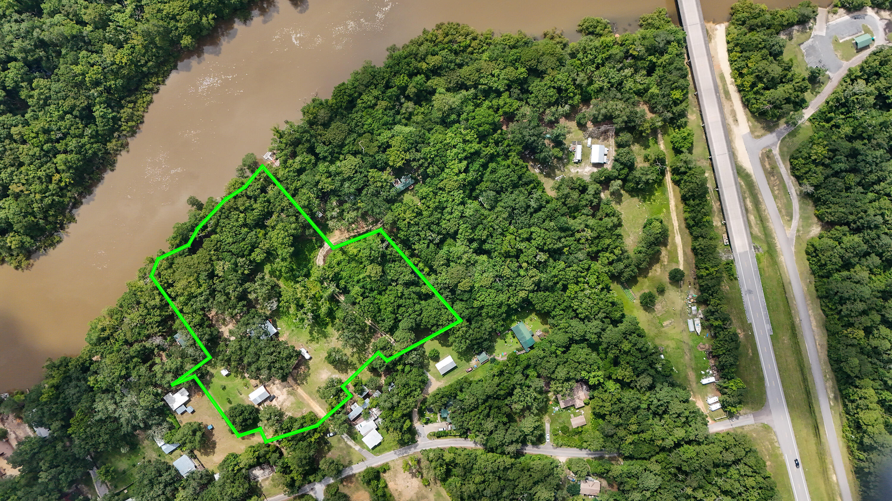 Discover your serene oasis at 70 River Loop Road, Bruce, FL 32455. Nestled on 3.13 acres of pristine land, this stunning property is situated right on the majestic Choctawhatchee River. Offering unparalleled privacy, this spacious 3-bedroom, 2-bathroom home boasts approximately 2,120 square feet of living space, enhanced by the newly enclosed front sunroom.Perfect for outdoor enthusiasts, this home is a haven for fishing and boating activities. Imagine waking up to the tranquil sounds of nature and enjoying your morning coffee while overlooking the river. The property features a brand-new metal roof installed in the past year, ensuring peace of mind and longevity. This home is a work in progress and offers a fantastic opportunity for those looking to add their personal touch through renovations. Embrace the potential to customize this property to suit your vision and create your dream riverfront escape. Don't miss out on making this tranquil haven your own!
Whether you are seeking a peaceful retreat or a place to entertain family and friends, this unique property offers endless opportunities. Don't miss the chance to own your slice of paradise and embrace the outdoor lifestyle you've always dreamed of. Come experience the natural beauty and charm of this exceptional home today!