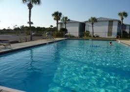REDUCED PRICE!! BRING OFFER! SOLD UNFURNISHED!!!A fantastic buy in the heart of Destin. With 3 pools, tennis courts and a lake for kayaking and fishing, you never run out of things to do. Right in the heart of Destin, you are within walking distance of the beautiful Gulf of Mexico, resturants, shopping and water park. This second story unit has tiled floors with new carpet in the bedroom and a covered tiled balcony. Newly painted walls throughout the condo give this a relaxing feel. Kitchen was remolded which really opens up the floor plan. Balcony was partially closed to allow for the dining and laundry. Association fees include basic cable as well as building insurance. Being sold AS IS.