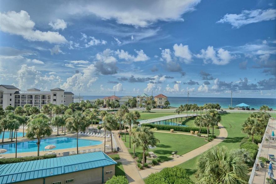 Beautiful top floor end unit with unobstructed Gulf view. Gated community and beach access. Granite counter tops, wood/tile floors and new custom cabinets. This unit has all newer faucets,hardware and paint. Newer stainless freezer/fridge and garbage disposal. Garage storage and covered assigned parking. Property club has a gym looking over the pools. HOA includes: Cable, internet, Gym, club house, water trash and pest control.