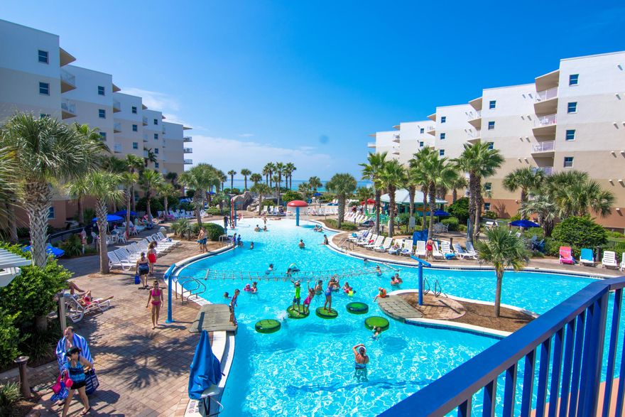 The pinnacle of Gulf front living, this stunning 2 condo at Waterscape features 2 Gulf front master suites, a bunk room and 2.5 baths - a spectacular beach getaway AND investment property with proven rental history in the #1 area rental property. Imagine one of the area's most luxurious condominium complexes with every amenity desired including 490 feet of pristine beach front. When initially designed, every condo was angled to maximize the best Gulf of Mexico views through floor to ceiling doors and windows. This condo conveys fully furnished with upgrades throughout - from granite in the kitchen, stainless steel, wood & tile floors plus a locked storage closet. The remarkable courtyard features 3 pools, 2 hot tubs, waterfall and a famed Lazy River that you have to see to believe! There