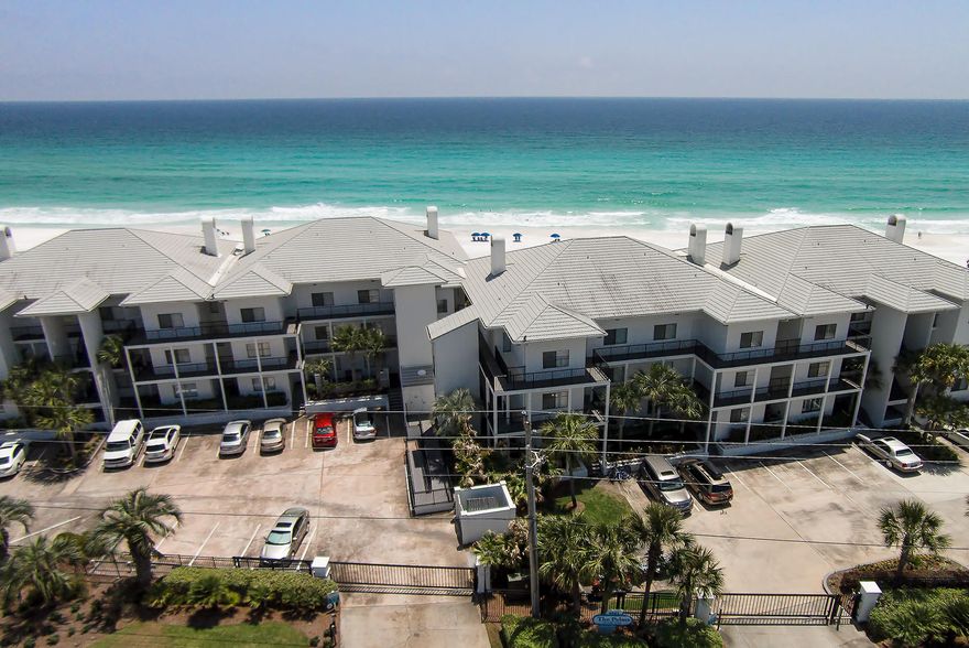 EXCLUSIVE, METICULOUSLY MAINTAINED GULF FRONT COMPLEX IN DUNE ALLEN....! This three bedroom, three bath condo has been extensively renovated with the utmost attention to detail. Brand new kitchen and bathrooms compliment the new hardwood floors. Enjoy the western sunset views from this very open unit with the fabulous wrap around, 33 foot covered porch. The gated Palms of Dune Allen features a private Gulf Front pool with incredible views of the pristine beach. This is the perfect location just minutes away from excellent restaurants, shopping and entertainment....!