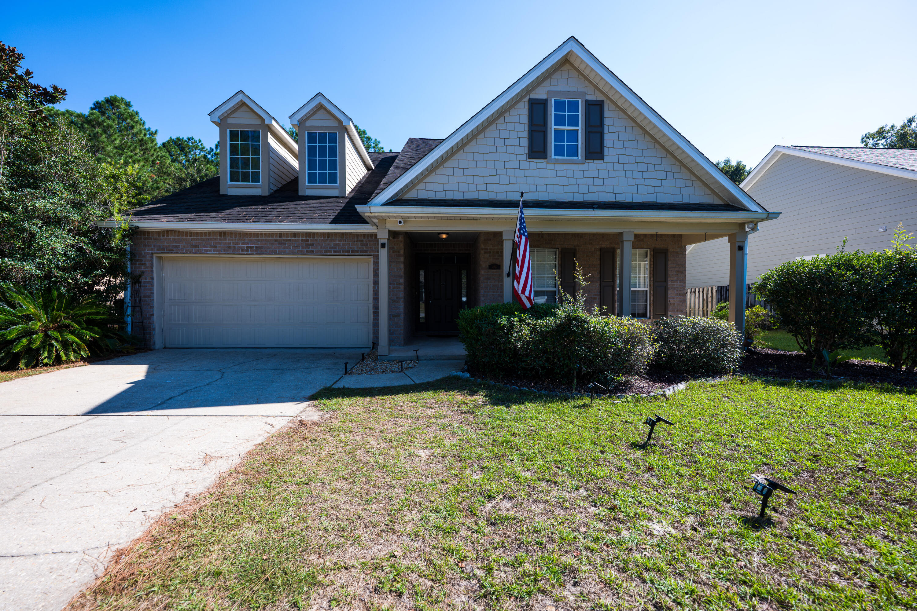 Beautifully maintained Preserve home in Hammock Bay! Enjoy peaceful nature views from the screened porch, sunroom, or large private deck. Spacious open living area features a stunning gas fireplace and easy-care floors with fresh paint inside and out. The kitchen offers abundant cabinets, ample counter space, and a bright dining area overlooking the woods. Split floor plan provides privacy with an oversized primary suite, large walk-in closet, and bath with double vanities, soaking tub, and separate shower. Guest bedrooms feature new carpet and share a full bath. Hammock Bay offers resort-style amenities including pools, fitness center, clubhouse, walking trails, and more--all minutes to beaches and shopping.