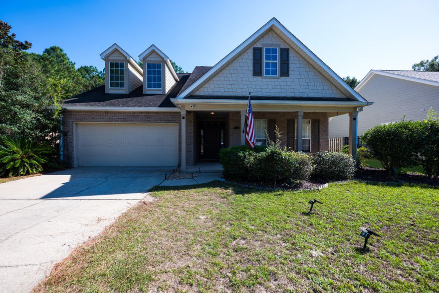 Beautifully maintained Preserve home in Hammock Bay! Enjoy peaceful nature views from the screened porch, sunroom, or large private deck. Spacious open living area features a stunning gas fireplace and easy-care floors with fresh paint inside and out. The kitchen offers abundant cabinets, ample counter space, and a bright dining area overlooking the woods. Split floor plan provides privacy with an oversized primary suite, large walk-in closet, and bath with double vanities, soaking tub, and separate shower. Guest bedrooms feature new carpet and share a full bath. Hammock Bay offers resort-style amenities including pools, fitness center, clubhouse, walking trails, and more--all minutes to beaches and shopping.
