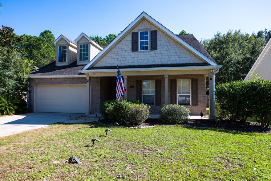 Beautifully maintained Preserve home in Hammock Bay! Enjoy peaceful nature views from the screened porch, sunroom, or large private deck. Spacious open living area features a stunning gas fireplace and easy-care floors with fresh paint inside and out. The kitchen offers abundant cabinets, ample counter space, and a bright dining area overlooking the woods. Split floor plan provides privacy with an oversized primary suite, large walk-in closet, and bath with double vanities, soaking tub, and separate shower. Guest bedrooms feature new carpet and share a full bath. Hammock Bay offers resort-style amenities including pools, fitness center, clubhouse, walking trails, and more--all minutes to beaches and shopping.