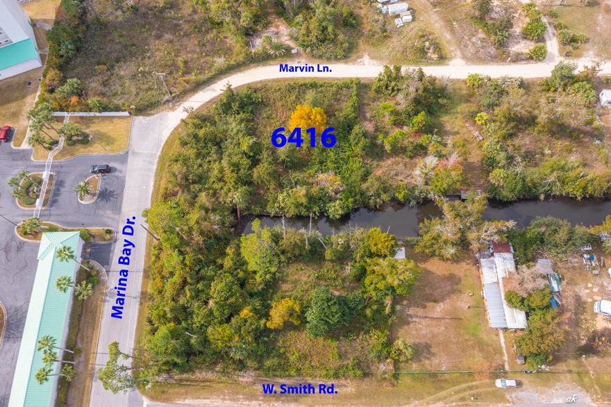 Whether you're searching for a primary residence or a weekend retreat with boating access, this property is the perfect fit. This .27-acre canal lot offers quick access to the deep waters of North Bay and is conveniently located near Lynn Haven's shopping and dining. The land is vacant, ready for clearing and building. Buyers are encouraged to verify all information.