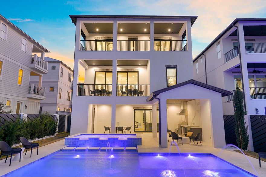61 Penny Lane is a luxurious 8-bedroom, 9-bathroom home just steps from the beach. With 2 bunk rooms and en-suite bathrooms for every bedroom, expansive balconies with gulf views make this home ideal for hosting large groups. The chef's kitchen and expansive living areas provide comfort and style, while the $60,000 Viking outdoor kitchen, massive heated pool, and spa create the perfect space for outdoor entertaining. Located by Ed Walline Beach Access and dining in Gulf Place.