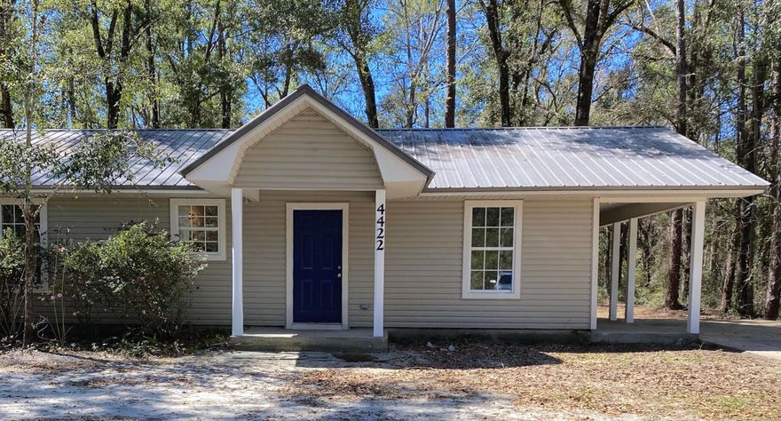 Back on the Market! New Paint! New Floors! New Appliances! Metal Roof! Less than a mile to boat launch near Outpost on Black Creek. Florida cottage situated on a paved road with large oaks and plenty of room for additions. The home has a front porch, a side covered porch and large covered back porch and deck just off of the living area making the home feel bigger than the 1025 square foot. This home has 2 large bedrooms and 2 full bathrooms. Concrete Parking pad, large storage/workshop built in the back yard. This is a great starter home.