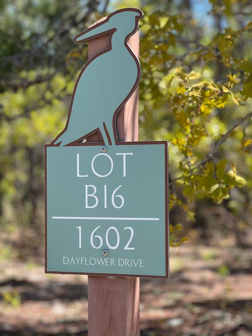 Beautiful wooded lot in desirable Wild Heron.  Golf course winds throughout area and behind this lot.  Plan and build your dream home.