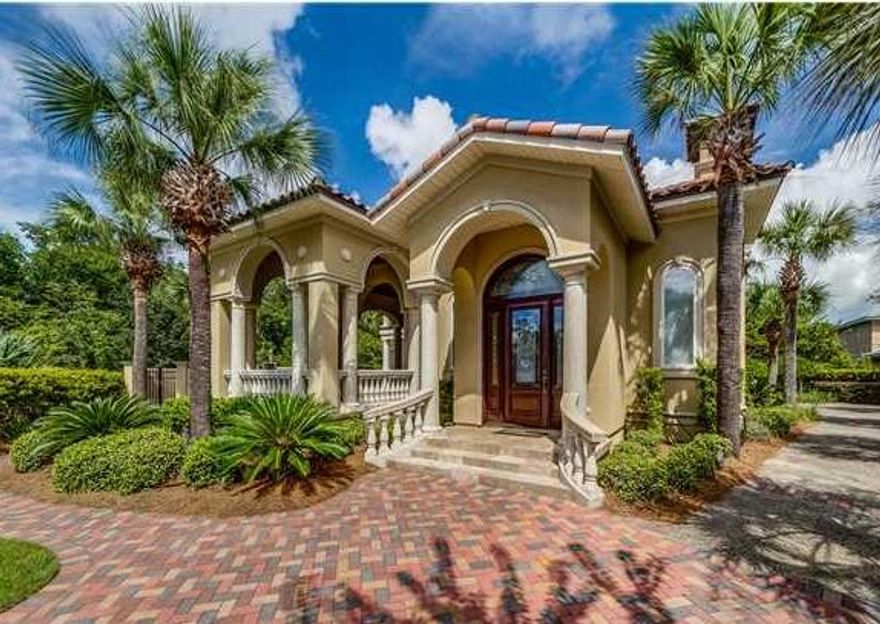 Reduced $30,000 1/1/15. Custom-built home in prestigious Finisterre. The details & quality of construction are incredible. The home is wrapped around a beautiful courtyard pool & loggia. The first floor has oak flooring in the living room, dining room & kitchen with 13' and 14' high ceilings, crown molding and built-in sound system. The huge gourmet kitchen is very functional with a large granite island and snack bar. The first-floor master bedroom suite has a poolside patio & luxurious bath. Upstairs is a den with wet bar and balcony overlooking the pool and two bedrooms that share a bath. This home has to be seen to be appreciated. Finisterre is a gated waterfront community with tennis courts, playground & boat dock. Close to several marinas, the beach, & St. Andrews State P