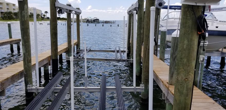 Have a boat? Jet skis? Need a slip? Village at Navarre Boat Dock and Slip #14 are in the Sound / Intracoastal Waterway at Village at Navarre on Navarre Beach. Slip has been reinforced and outfitted with both a boat lift and double jet ski lifts. Boat slips are available only to property owners at Village at Navarre, and this one is being sold with the lot at 1418 Sonata Court. Ready to build your beach house? The preliminary leg work for building on this lot has been completed, including soil testing, a new survey, and house plans drawn by a local architect which have been submitted to the Village at Navarre architectural review board. Boat lovers, this is an outstanding opportunity to dock your boat and jet skis, have access to the Sound, and build now or later. See also MLS #827786