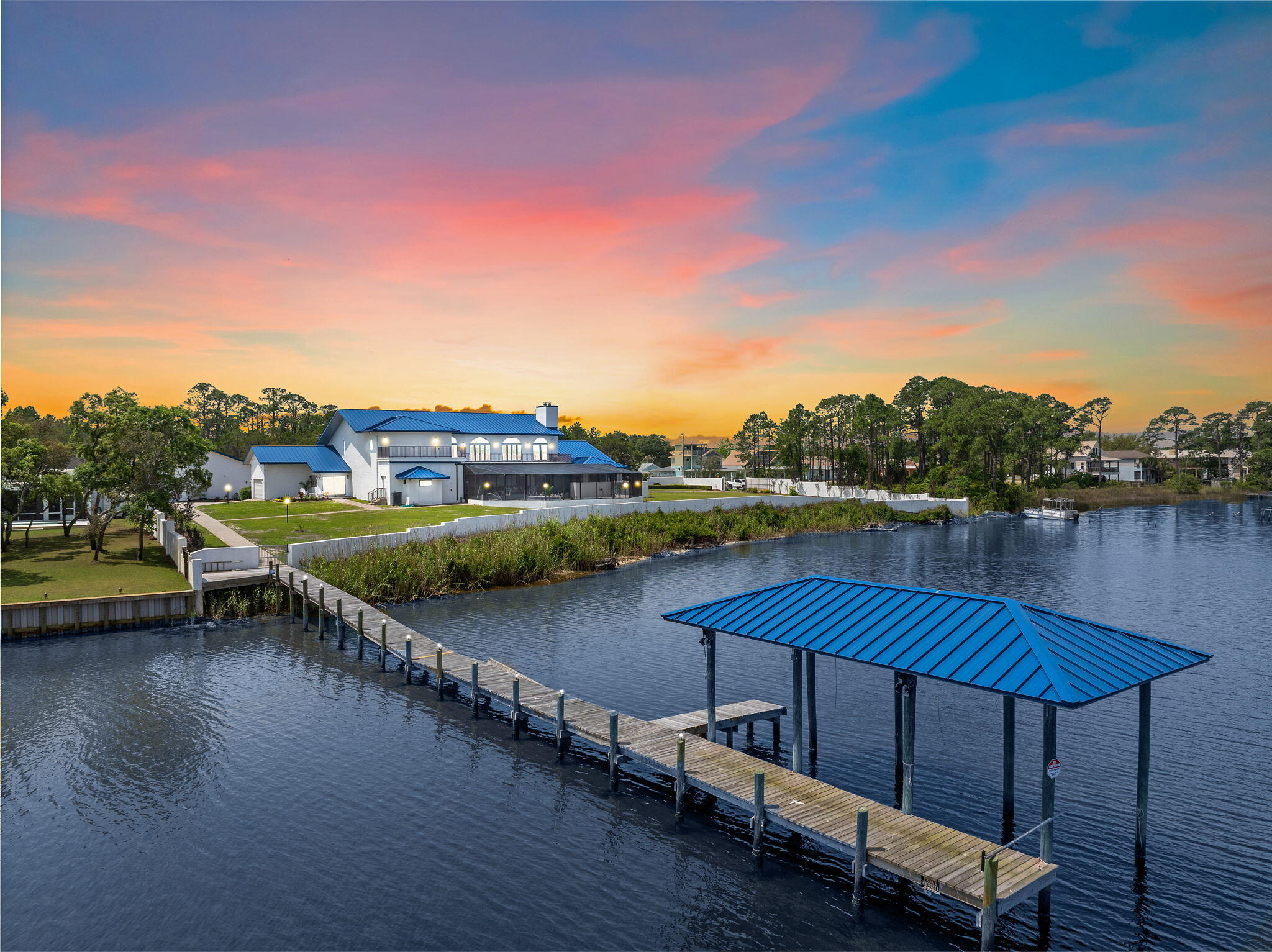 PARADISE FOUND... Discover the beauty of Northwest Florida living on a gorgeous Coastal Dune Lake in Northwest Florida boasting over 2 acres of land and 330 feet of coastal waterfront. This private luxury estate home has unobstructed water views secured by a privacy gate and wall surrounding the entire property. A perfect location provides privacy & serenity, yet just one mile from our gorgeous white sand beaches and two miles from world renowned Scenic Highway 30A, home of Rosemary Beach, Alys Beach and Seaside. Here, world class dining, shopping, golf and year-round events await you. The Northwest Florida Beaches International Airport is a short 20-minute drive. This refined and recently remodeled custom built estate home offers a dramatic floating staircase entrance, elevator, private library with safe room, formal dining room, gourmet kitchen, breakfast room, media room, mahogany bar, 7 bedrooms & 5.5 bathrooms. With 8640 square feet of living space, you'll discover many custom craftsman features like the 24-foot vaulted ceilings in the main living room showcasing a fabulous soaring fireplace and pocket patio doors that open out onto the vast screened lanai and saltwater pool. You'll discover custom craftsman features throughout the home with an abundance of natural light on both floors. The large en-suite master bedroom on the first level features a gas fireplace connecting to a large master bathroom space which awaits custom finishes to your taste. There are marble floors, a sunken soaking tub, walk in shower, dual vanities and large closets. A beautiful glass garden room with a built in sunken jacuzzi completes the master suite. On the upper level, two bedrooms currently serve as a personal gym with professional gym equipment plus a full bath and walk-in shower. The additional three modern bedrooms & baths offer comfortable living space for family and friends. The mezzanine balcony upstairs overlooks the living room and offers panoramic views of the water. Two large outdoor balconies spanning the length of the house can be accessed from this level. Welcome to outdoor living at its' best featuring a beautiful, screened lanai patio, fountain, and saltwater pool which overlook the waterfront. Morning sunrises to the east and sunsets to the west, this space is designed for entertaining and family fun. There is also a private dock & boat house for your boat, plus fishing, paddle boarding and kayaking on the water. Additionally, the 2400 square foot detached garage/apartment will accommodate your cars, car collection, Motor coach RV, boat, golf cart and much more! There is also a 2-car garage attached to the main house. High level security systems and a commercial back up generator ensure safety and security. No HOA fees, zoning is R-1 Residential Single Family. A superb northwest Florida location in a highly desirable area with rare waterfront acreage for the family, pets, vehicles, boat, motor coach, and beach gear. Contact Listing Agent for your private viewing.