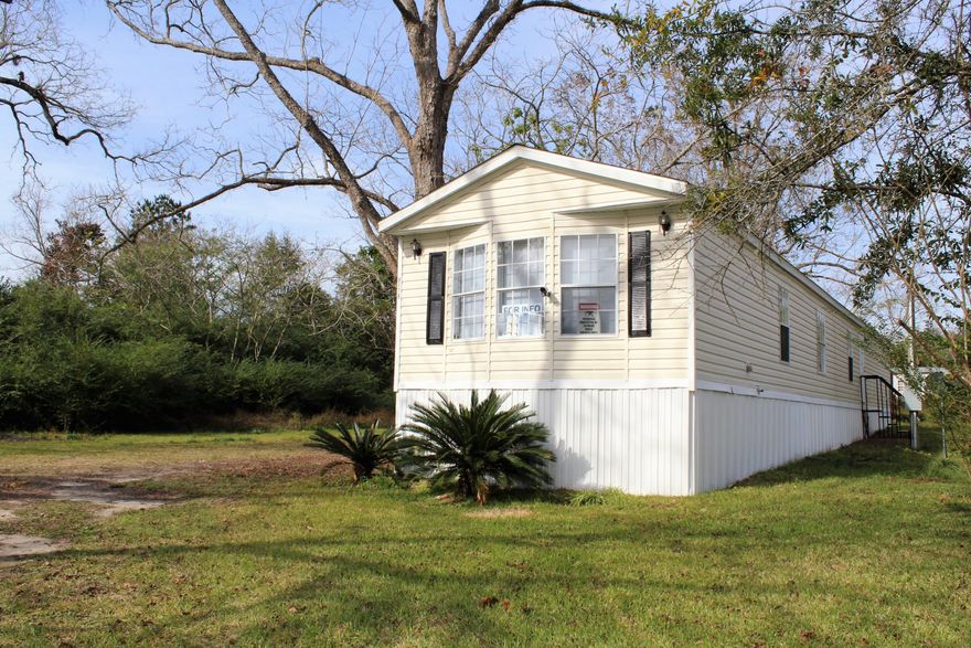 This great 3 bedroom 2 bath home on 0.21 acre in Laurel Hill will make a perfect starter home. New carpet and paint throughout. Cute island kitchen with plenty of cabinet space. Relax in the cozy master bedroom and enjoy the spacious master bath with garden tub. *Seller financing available WAC***All measurements approximate; buyer to verify**