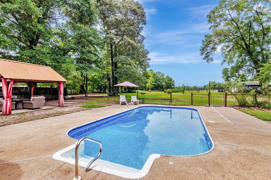 Welcome to Your Own Private Sanctuary in Laurel Hill. If you've been dreaming of a peaceful place to put down roots--with room to roam, space to create, and the freedom to live life your way--3544 State Hwy 85 might just be the one. Set on 3 beautiful acres, this just-over 2,000 sq ft home is more than a house--it's a lifestyle. Whether you're looking to spread out, start a mini homestead, or simply escape the hustle and bustle, this property is the kind of place that welcomes you home with open arms. Imagine mornings spent sipping coffee under the gazebo by the pool, listening to the fountain bubble while the sun peeks through the trees. The scent of gardenias floats on the breeze, your dogs are stretched out in the sun, your garden is freshly watered from the irrigated beds, and your home feels fresh and inviting with new paint in the main living areas.
Inside, you'll find 3 spacious bedrooms and an easy flow perfect for everyday living and casual gatherings. But it's what's beyond the walls that really sets this home apart. You'll love the garage that doubles as a screened roomthe perfect spot to sit and watch summer storms roll in without the bugs. Need a place to tinker, build, or create? The workshop is ready for you, fully equipped with power, water, and an automatic garage door. If animals are part of your world, they'll feel right at home too. There's a fenced-in stable area for your critters, and even a "Catty Shack" fit for a kingor your favorite feline. Chickens, goats, ponies, pups... this is the kind of property where your whole family (two-legged or four) can thrive. Whether you're hosting weekend barbecues by the pool, harvesting veggies from the garden, or just soaking up the quiet, this Laurel Hill property offers that rare mix of freedom, function, and heart. Conveniently located off Hwy 85 with quick access to Crestview and surrounding areas, you can enjoy the best of both worldssecluded country living with modern convenience nearby. If you're looking for a place where life feels simpler, animals are welcome, and there's space to grow into your next chapter, welcome home.