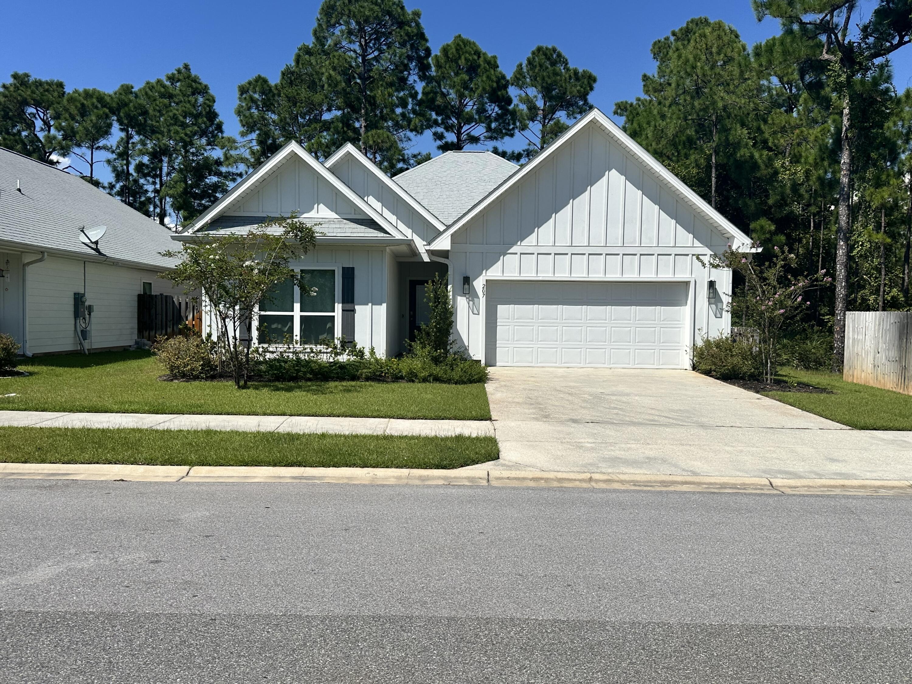 Beautiful, recently built, 5 bedroom, 3 bath house convenient to shopping, dining, state parks and the beach. This home comes partially furnished. The living room, two bedrooms and one office have been furnished and ready for move in. There is LVP throughout the entire home. The home also features Stainless Steel appliances and beautiful granite countertops as well as a fenced in backyard. Washer, dryer, and alarm system included. Internet, garbage and pest control included in rent.