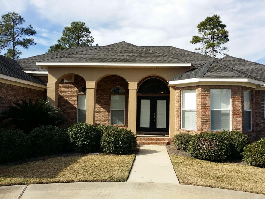 No details have been left out of this stunning custom home on the 13th fairway. Custom cherry cabinetry and matching built-ins in the master bedroom, great room, office/library and wet bar. Even the floors in the main living area are a rich, gleaming cherry hardwood. Trey ceilings, crown moulding and plantation shutters throughout the house. The great room features a built-in cherry entertainment center and a see-through gas fireplace between the great room and master bedroom. The home is wired for surround-sound inside and out, and is also wired for a pool alarm and six TVs, including one in the master bath. Watch your favorite show while soaking in the heart-shaped whirlpool tub. The kitchen has dark granite counter tops, GE appliances, an island with storage, and a separate
