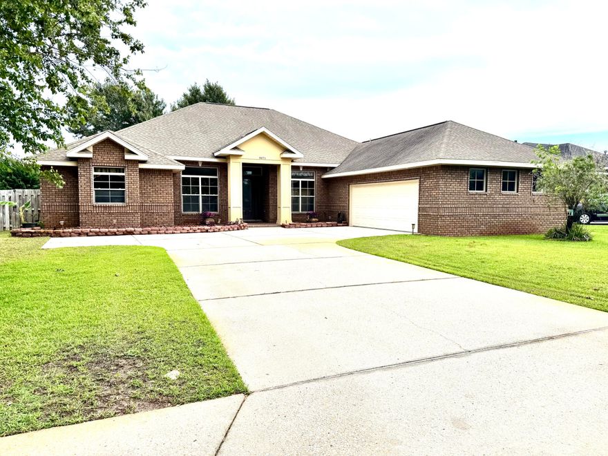 This is the home you've always wanted: a four-bedroom, three-bath executive house in a gated, waterfront community.  Located in the last peaceful part of Florida's Emerald Coast, this nearly 3000 square foot home, with its high ceilings and generous windows, feels as spacious as a palace.  The centerpiece of the home is the open plan kitchen, with stainless steel appliances, smooth cooktop, granite countertops, and a generous island with a separate sink for preparing meals.  The home features upgraded architectural elements such as numerous arches and pillars, an eye-catching coffered ceiling, recessed lighting, large baseboards and crown molding.  The living room is dominated by the wood burning fireplace.  An office and a dining room are on either side of the main entrance. Most of the floors are travertine, with new, cozy carpeting in the bedrooms.  There's an oversize garage with an epoxy coated floor.  The back of the house is dominated by a covered back porch and a fenced backyard.

Heritage Park is a gated community located on the Santa Rosa Sound. Homeowners enter over a cobbled street and enjoy curbs and sidewalks, underground utilities, and a waterfront clubhouse. That's where you'll find an in-ground salt-water pool with the best views of the Sound, a gym, conference room, TV lounge, a full kitchen and deeded access to the beach so you go boating, fishing, or see the sunsets. The city of Navarre is away from the tourist areas but still close to the great shopping and medical facilities of Gulf Breeze, Pensacola, and Fort Walton Beach.  You are only minutes away from the restaurants and entertainments of Destin.  

Buyer to verify all dimensions and information.
