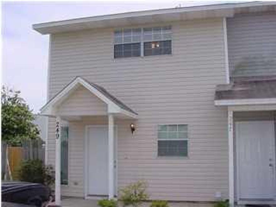 Convenient to Santa Rosa Mall and bases, this large end unit in townhome complex has new paint, new carpet, tiled kitchen, foyer and baths. In the kitchen refrigerator conveys as is. With a back yard larger than most, this unit has a privacy fenced back yard for pets. The gate will be replaced before closing. The complex also has a nice community pool for those hot sunny days, something you don't see in many townhome complexes. The upstairs has separate dressing area with walk-in closet, extra sink and vanity.