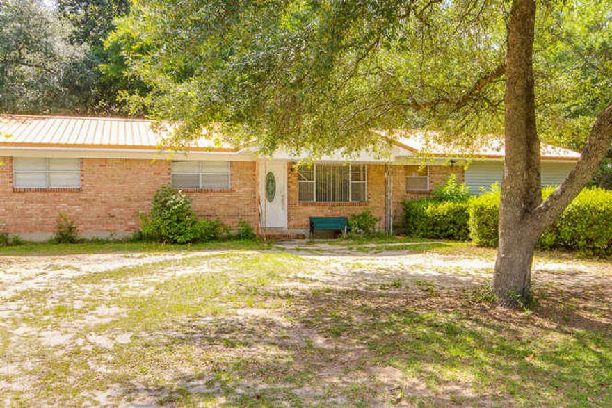 Charming 4 bedroom/2.5 bath with metal roof, new tile floors and appliances too. Seller has remodeled this home opening up the kitchen to the dining and living room areas. Canned lights and dimmer switchers also added.
Includes area for a mother-in-law suite and a theater room. Sits on 1.98 acres of cleared land.