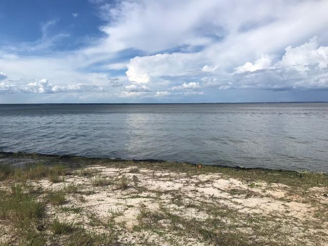Gorgeous .69 acre lot with 100 Feet on the Bay. Build your dream home on this large bay front lot. Driftwood Estates features many amenities including playground, picnic area, and more. Located closed to Sacred Heart Hospital, Grand Boulevard Shopping Center, Sandestin Golf & Beach Resort, Baytowne, restaurants, and just a short drive to the beach. Don't miss this amazing opportunity to own a Bay front lot at a great price, and there is no build out time. A must see!!!