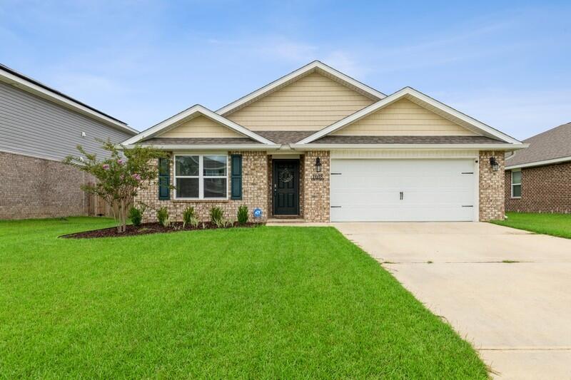 Welcome home to this beautiful 4 bedroom, 2 bath home in Redstone Commons! This split bedroom floor plan includes an open living space from the kitchen to the living room which both overlook the fully fenced back yard! Features include: recessed LED lighting throughout, kitchen island, granite countertops, large master bedroom with 2 master closets (one being oversized!), luxury vinyl plank flooring, blinds, gutters, and more! Enjoy the stunning community amenities that include A COMMUNITY POOL, DOG PARK, PICNIC AREA, and PLAYGROUND! Fast commute to schools, shopping, I-10, and local military bases!